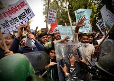 Supporters of protesting Indian farmers scuffle with police