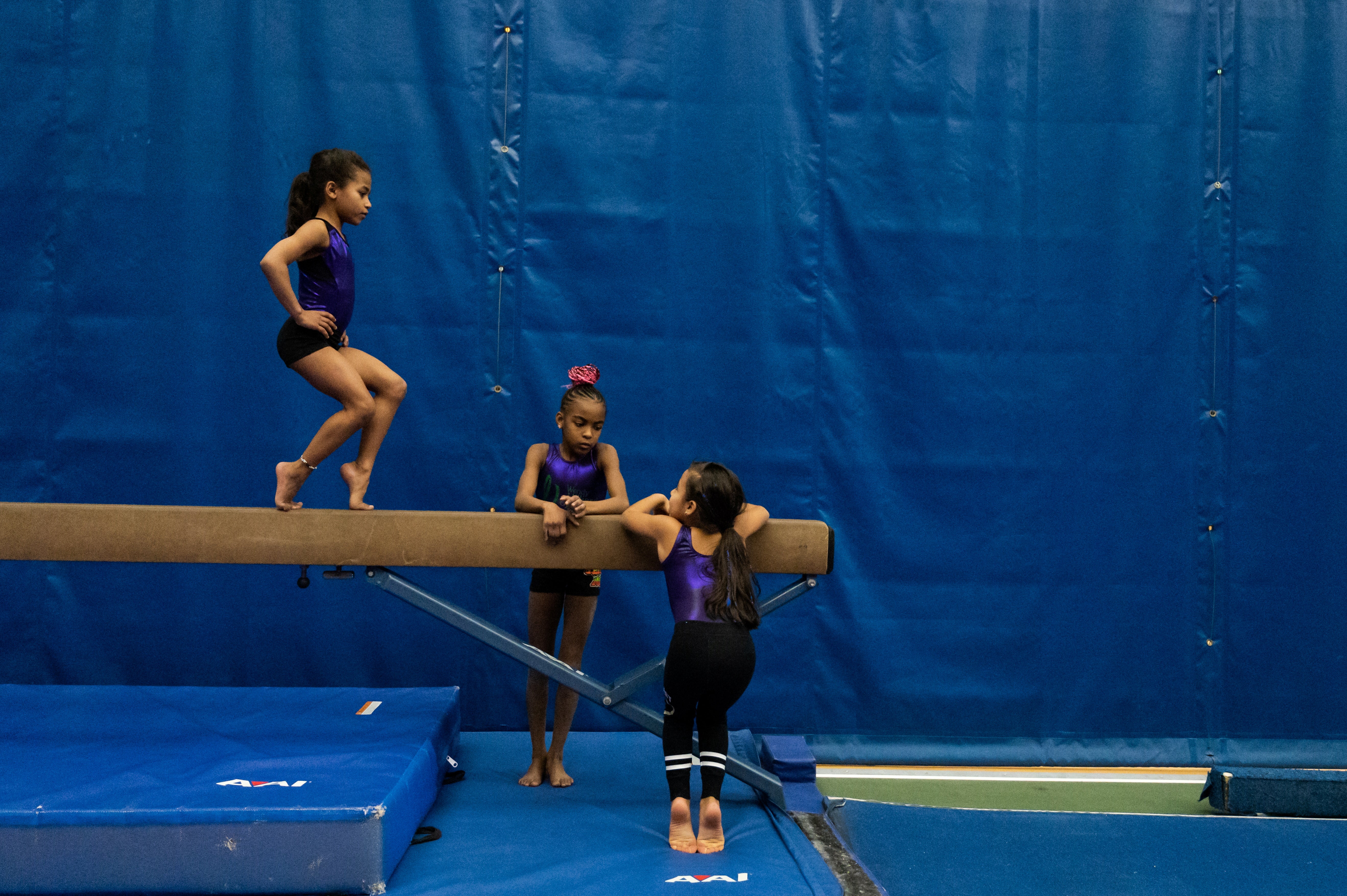 Gymnasts Hailey Montero, Rylee Bailey and Miranda Ortiz train