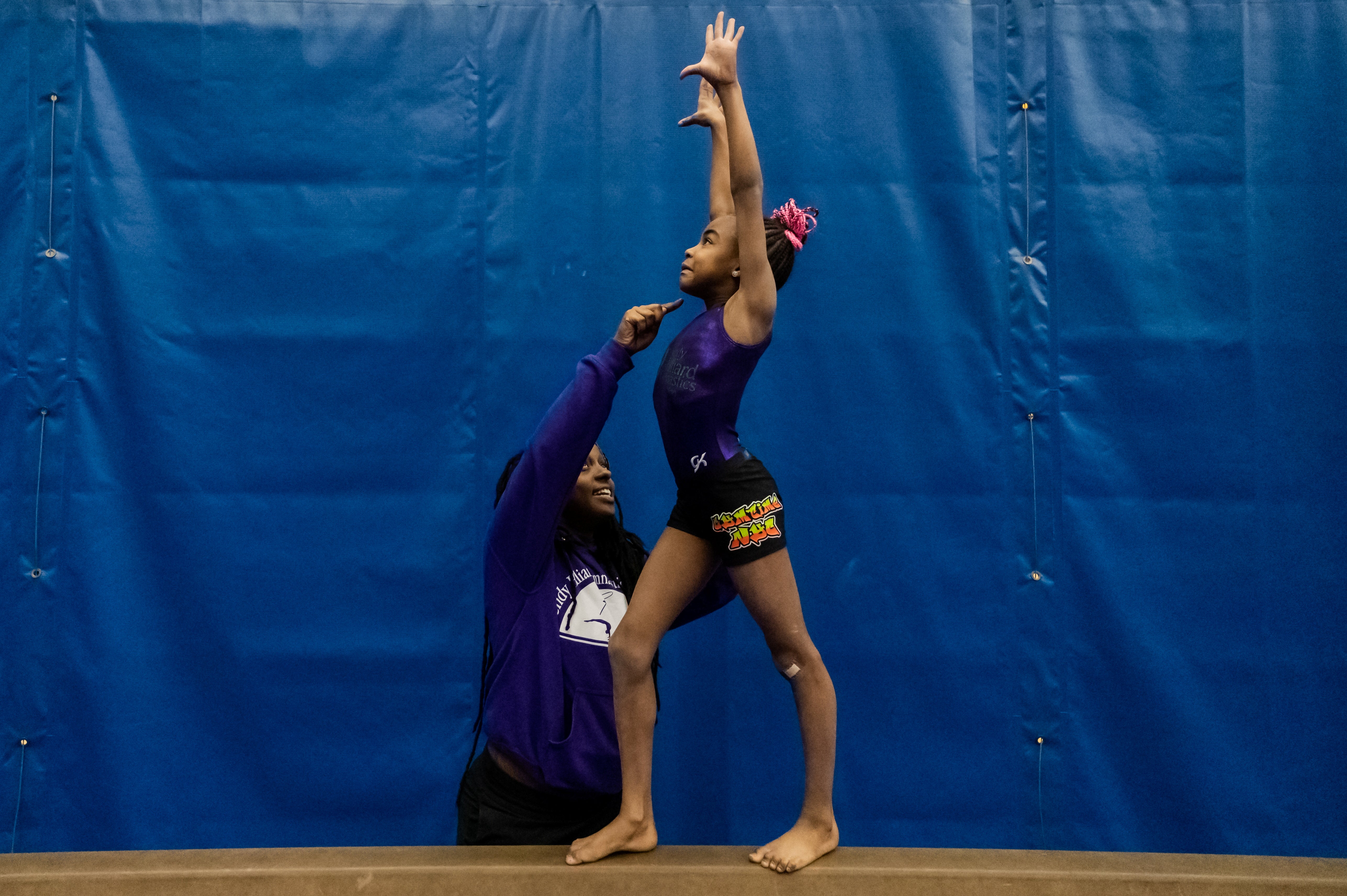 Coach Fabu Cox trains gymnast Rylee Bailey