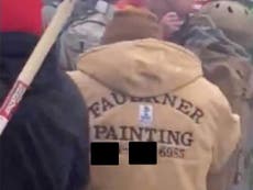 Capitol rioter wearing jacket with company’s name on has been arrested
