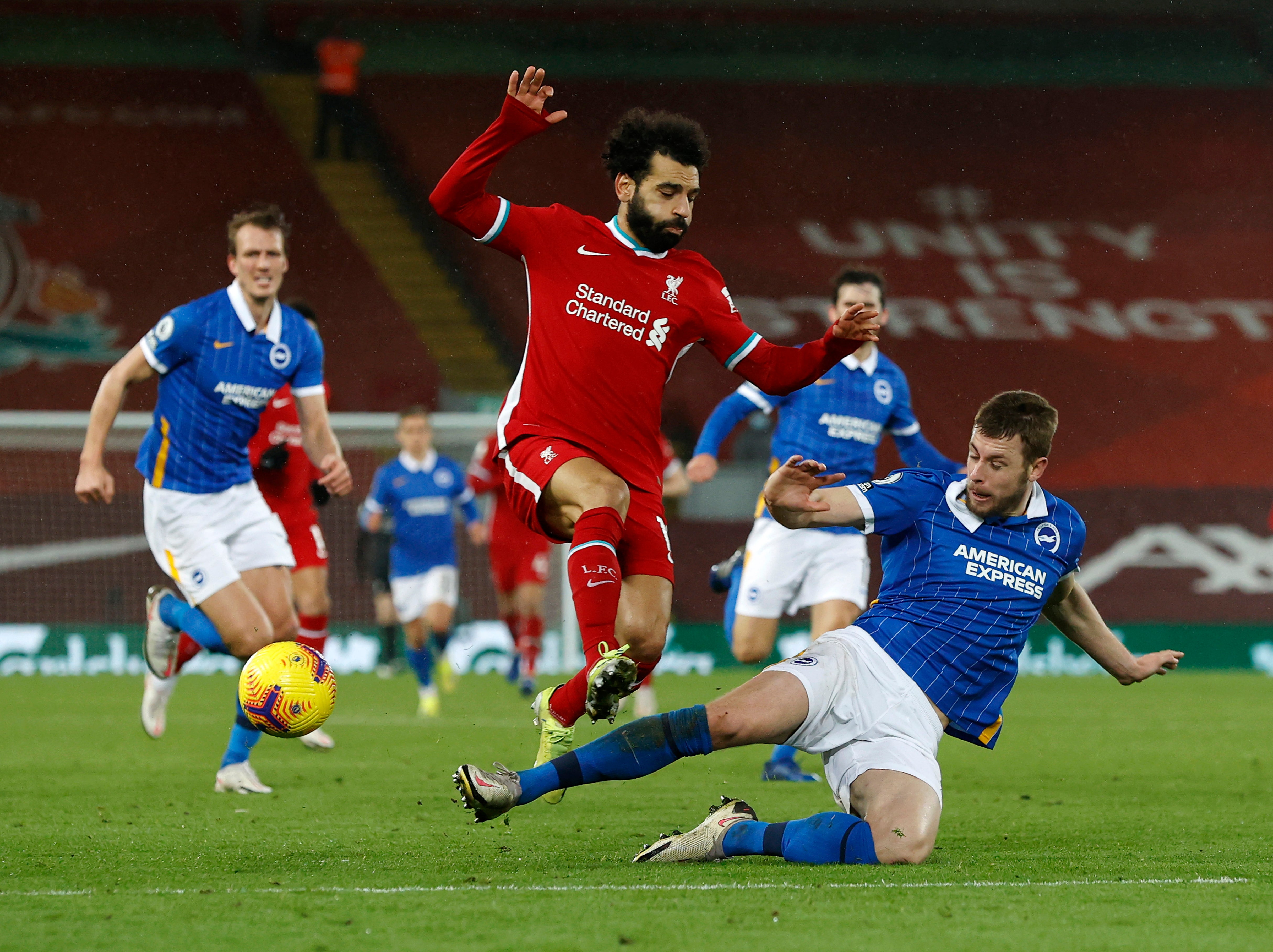 Mohamed Salah is tackled by Adam Webster