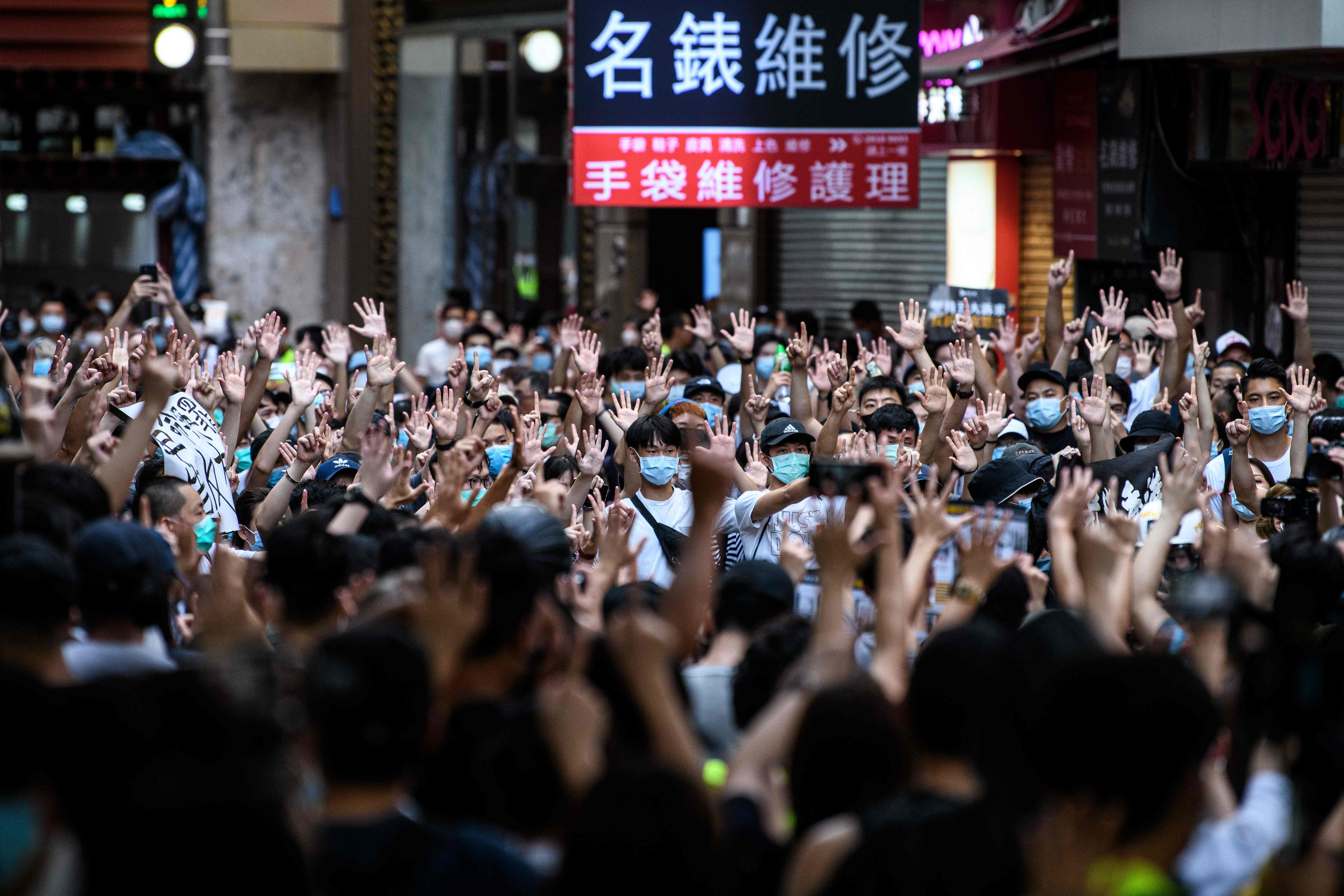 File image: Protesters in Hong Kong chant slogans during a rally against a new national security law in July 2020