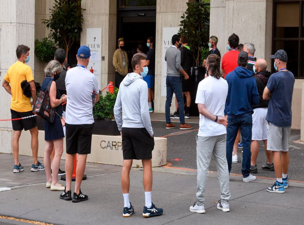 Tennis players queue for a Covid-19 coronavirus test at a hotel in Melbourne