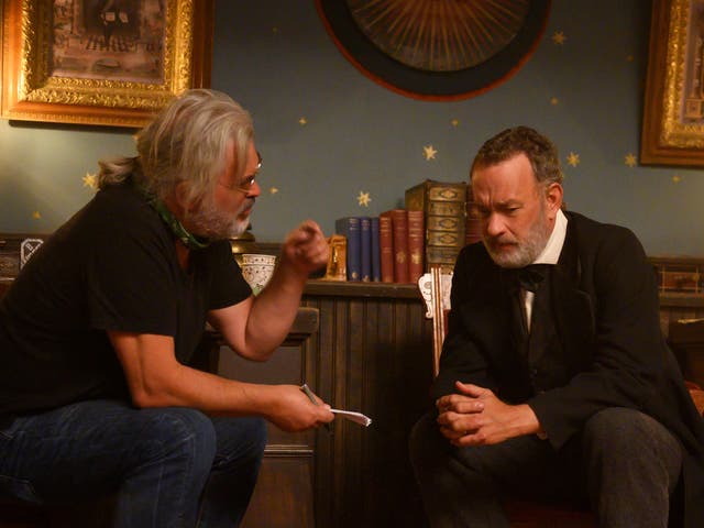 <p>Filmmaker Paul Greengrass with Tom Hanks on the set of ‘News of the World’</p>