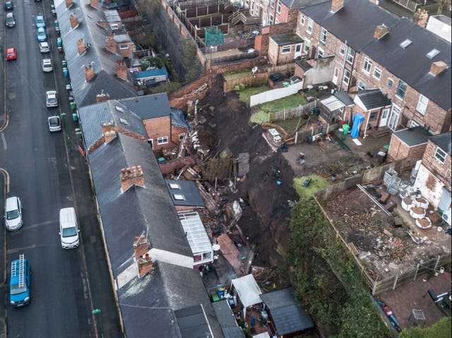 Five families were evacuated from their homes in the middle of the night after a “landslide” caused a 70ft wall to collapse into their properties
