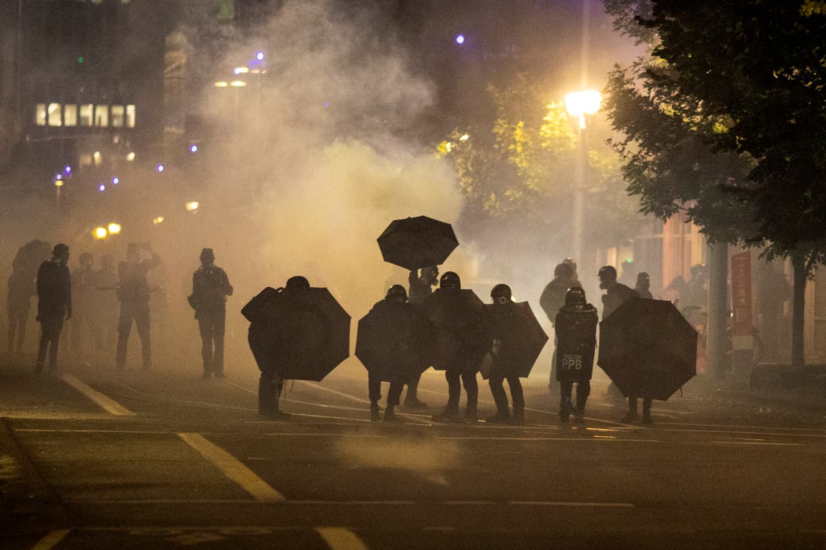 At least 100 protesters arrested as police kettle marchers in Portland