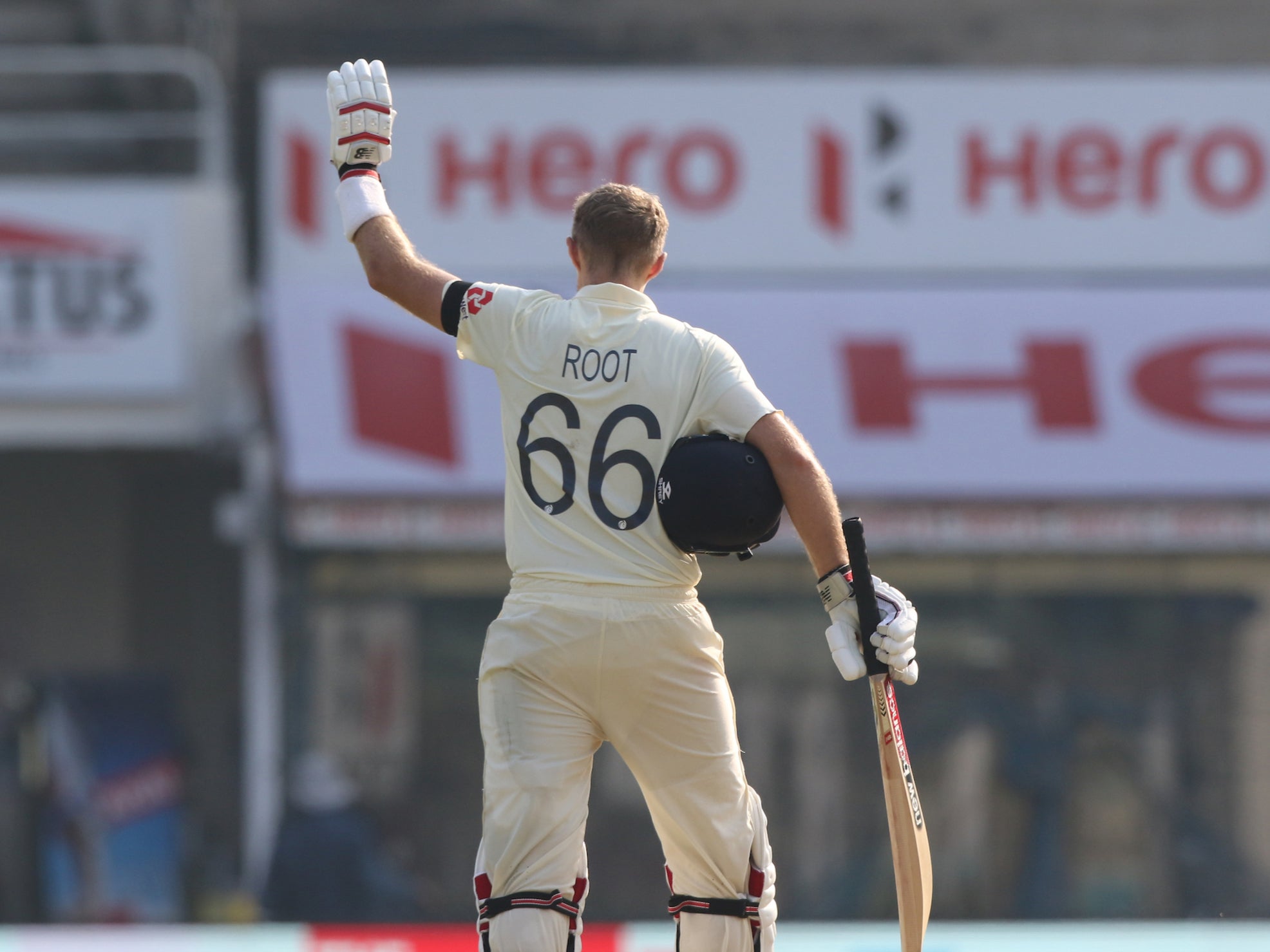 Root celebrates reaching three figures