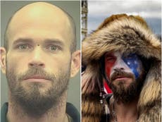 QAnon Shaman pictured without horns and face paint in mugshot, as he’s moved to jail with organic food
