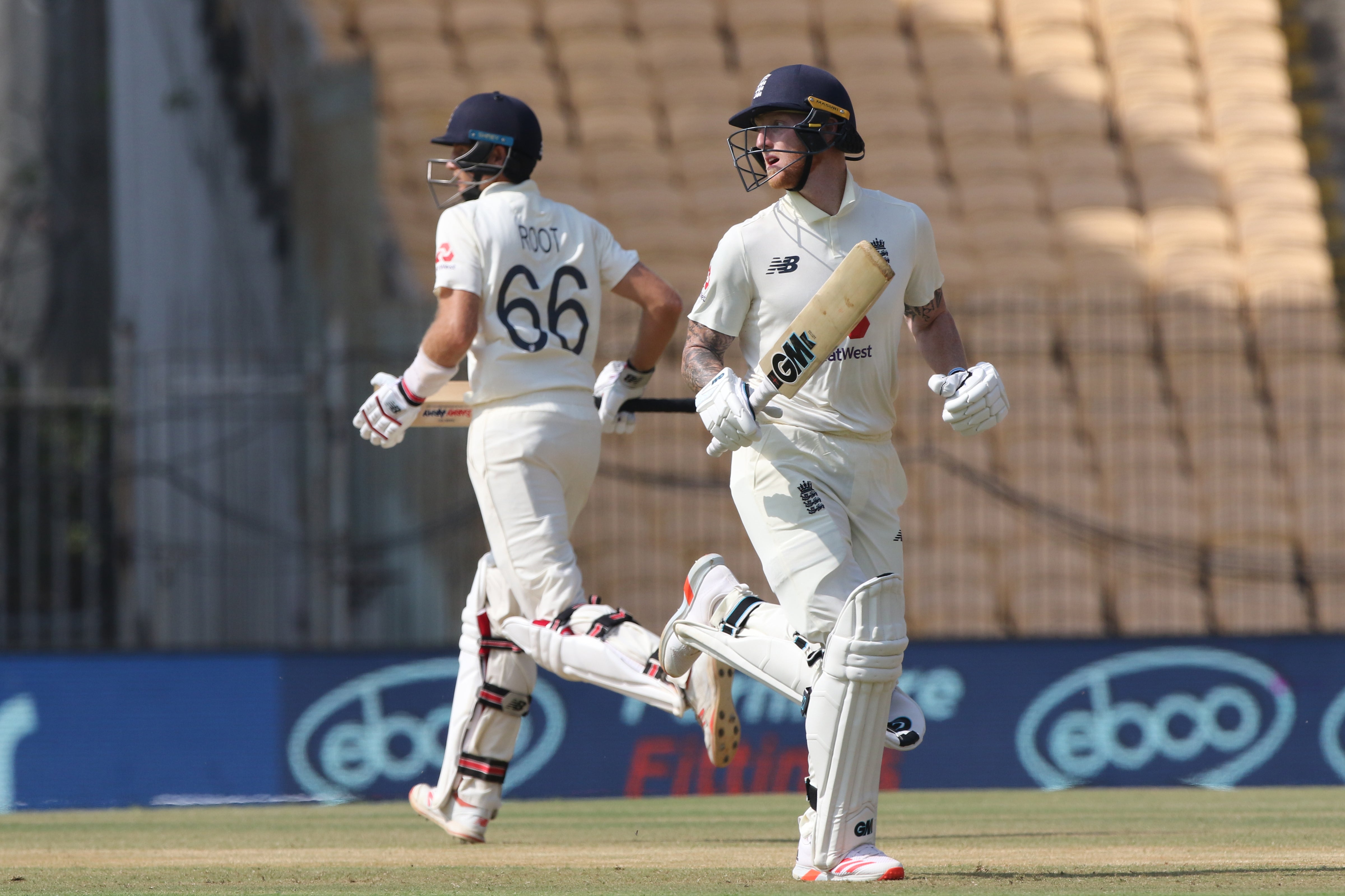 Ben Stokes and Joe Root run between the stumps during day two of the first test match between India and England in Chennai