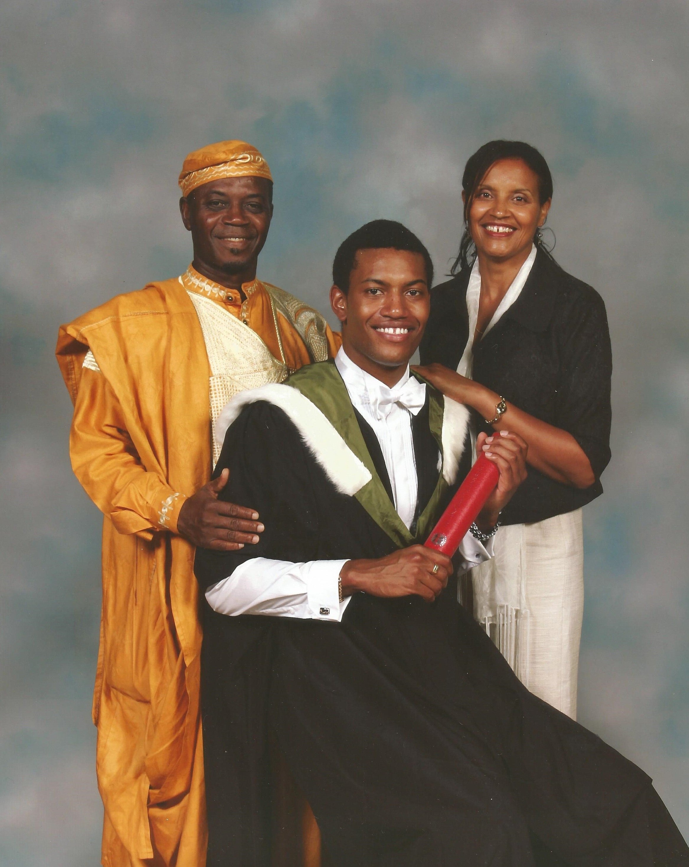 Senam at his graduation with his father, Yao, and mother