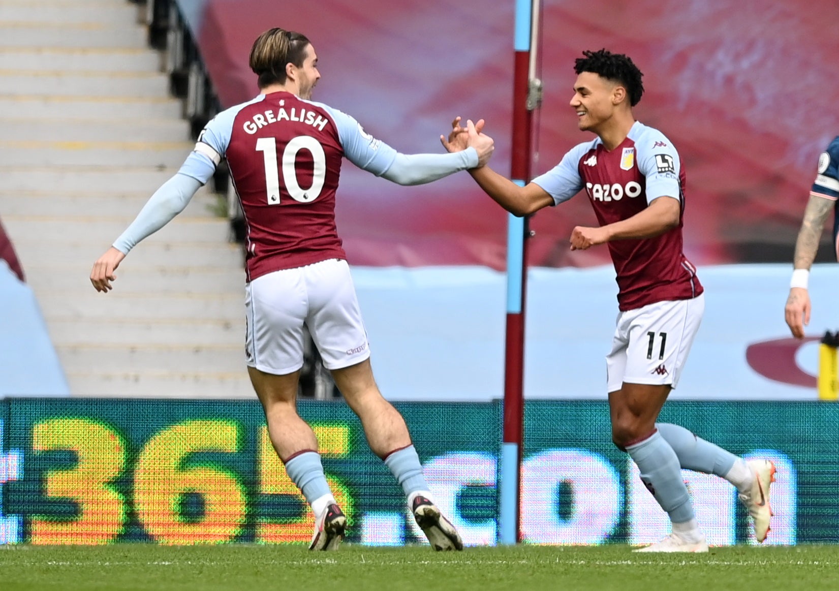 Ollie Watkins celebrates with Jack Grealish