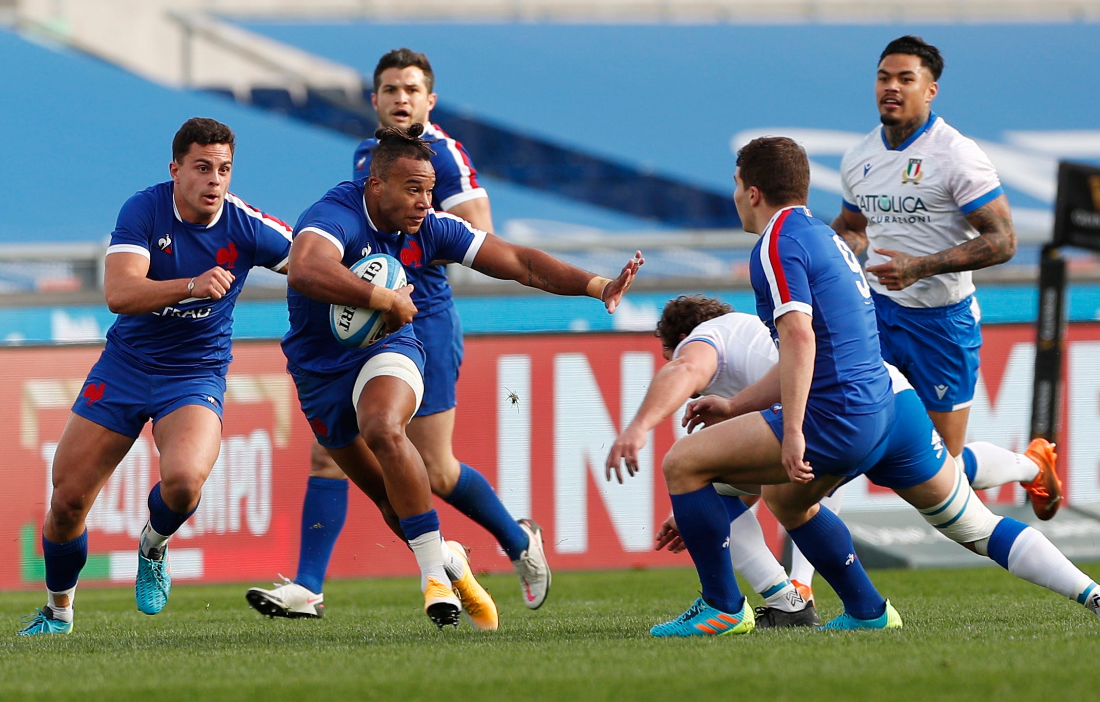 France’s Teddy Thomas tries to break through the Italian line
