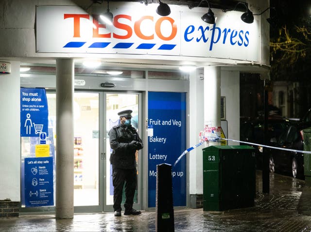 <p>Police at the scene of a stabbing incident on Willesden Lane, in Kilburn, north-west London, where one man has died and another is in a critical condition after a stabbing incident.</p>