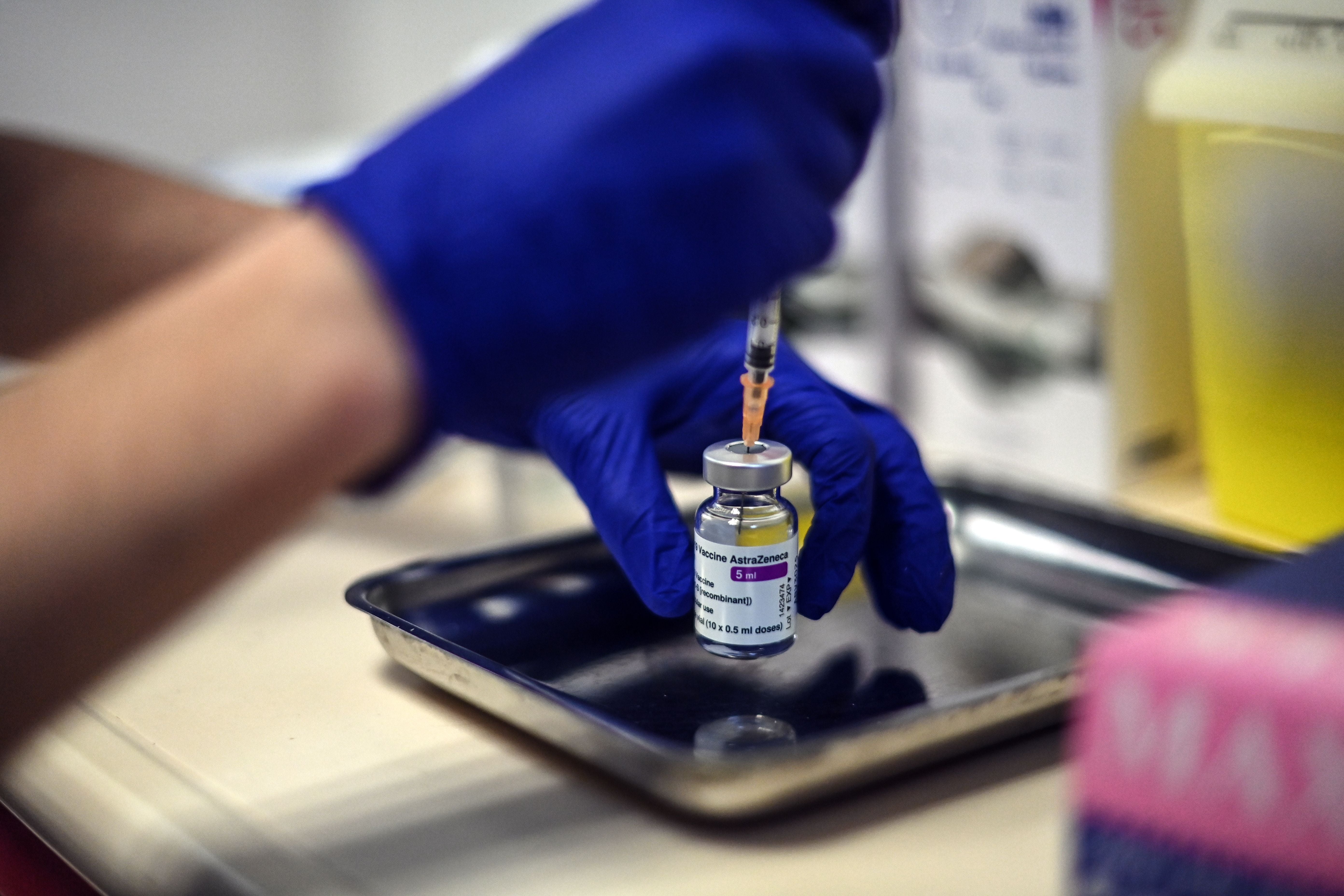 A nurse prepares a dose of the Oxford vaccine