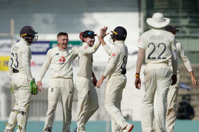 England team celebrates the wicket of Cheteshwar Pujara on day three