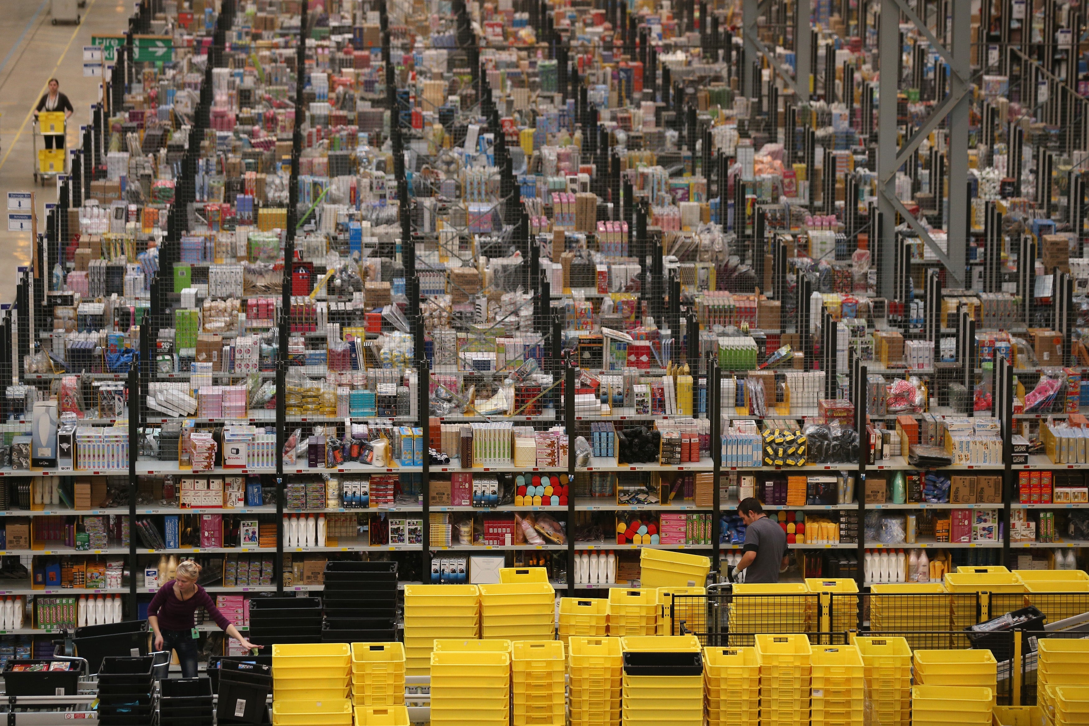 Employees select and dispatch items in the huge Amazon 'fulfilment centre' in Peterborough