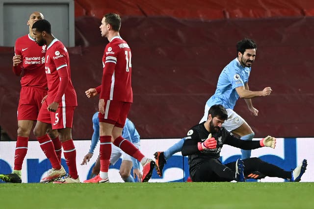 Alisson (second right) gifted Man City an unassailable lead at Anfield