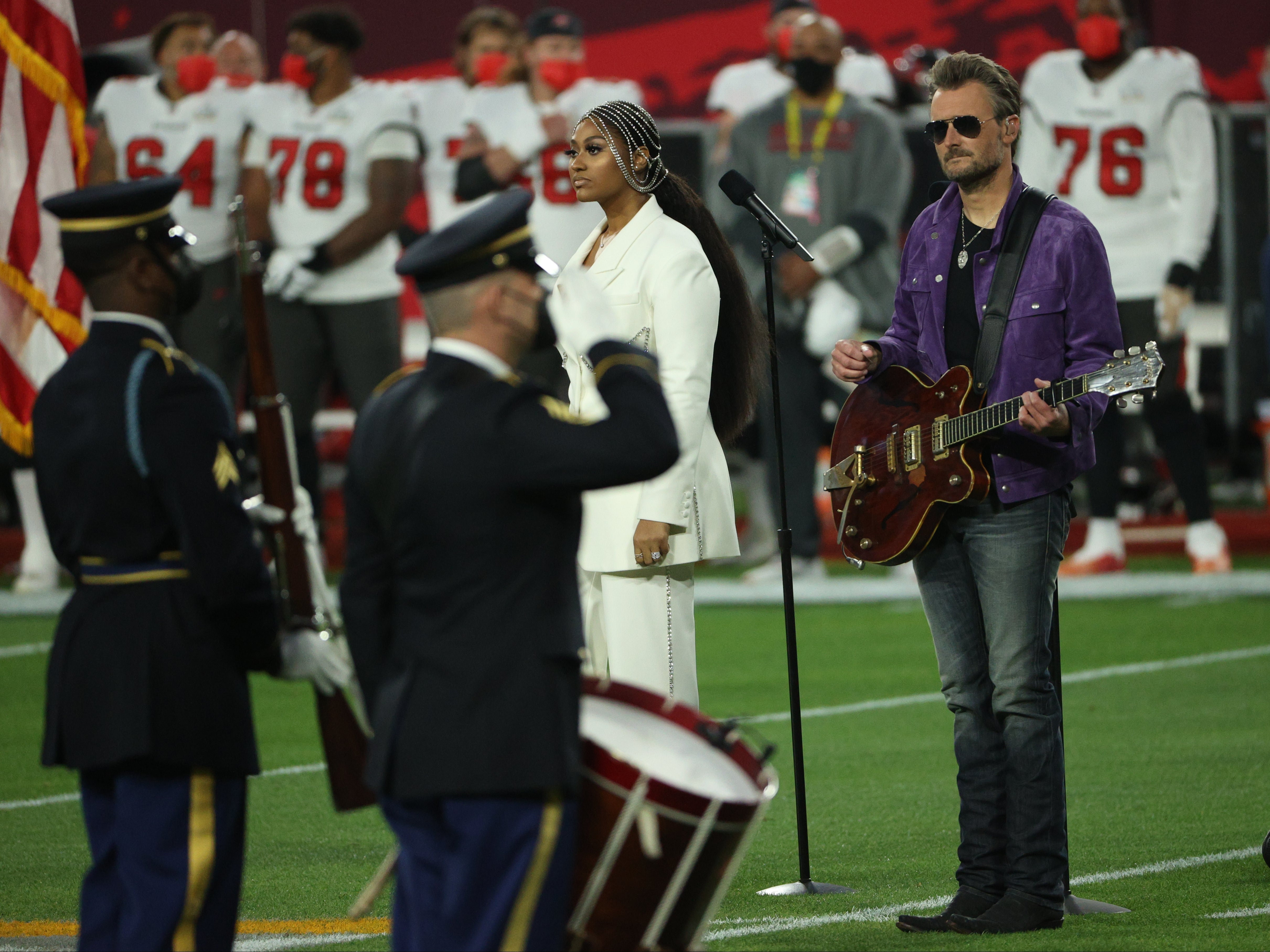 Jazmine Sullivan and Eric Church perform the national anthem at Super Bowl LV