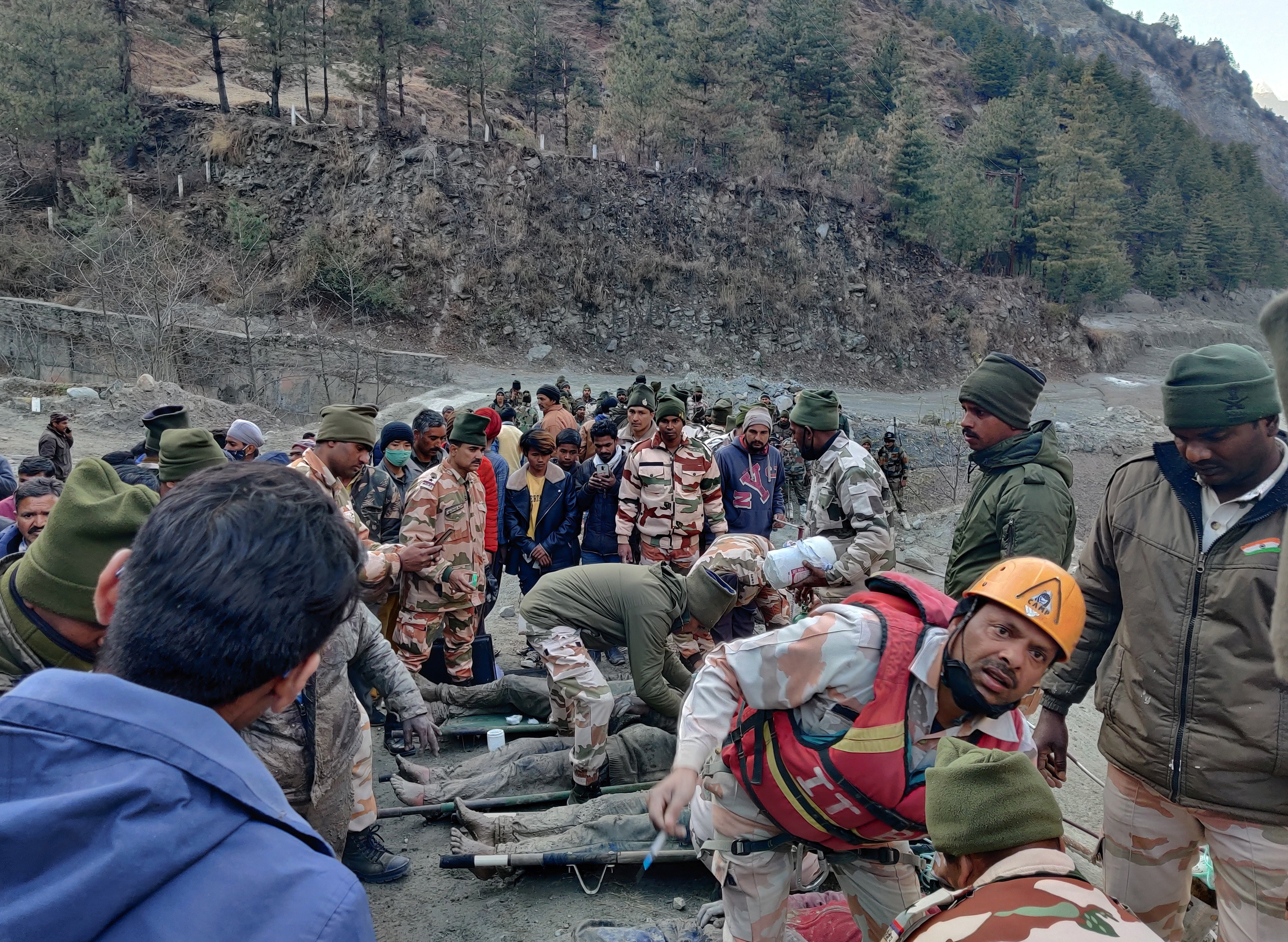 Members of Indo-Tibetan border police tend to people rescued after a Himalayan glacier incident