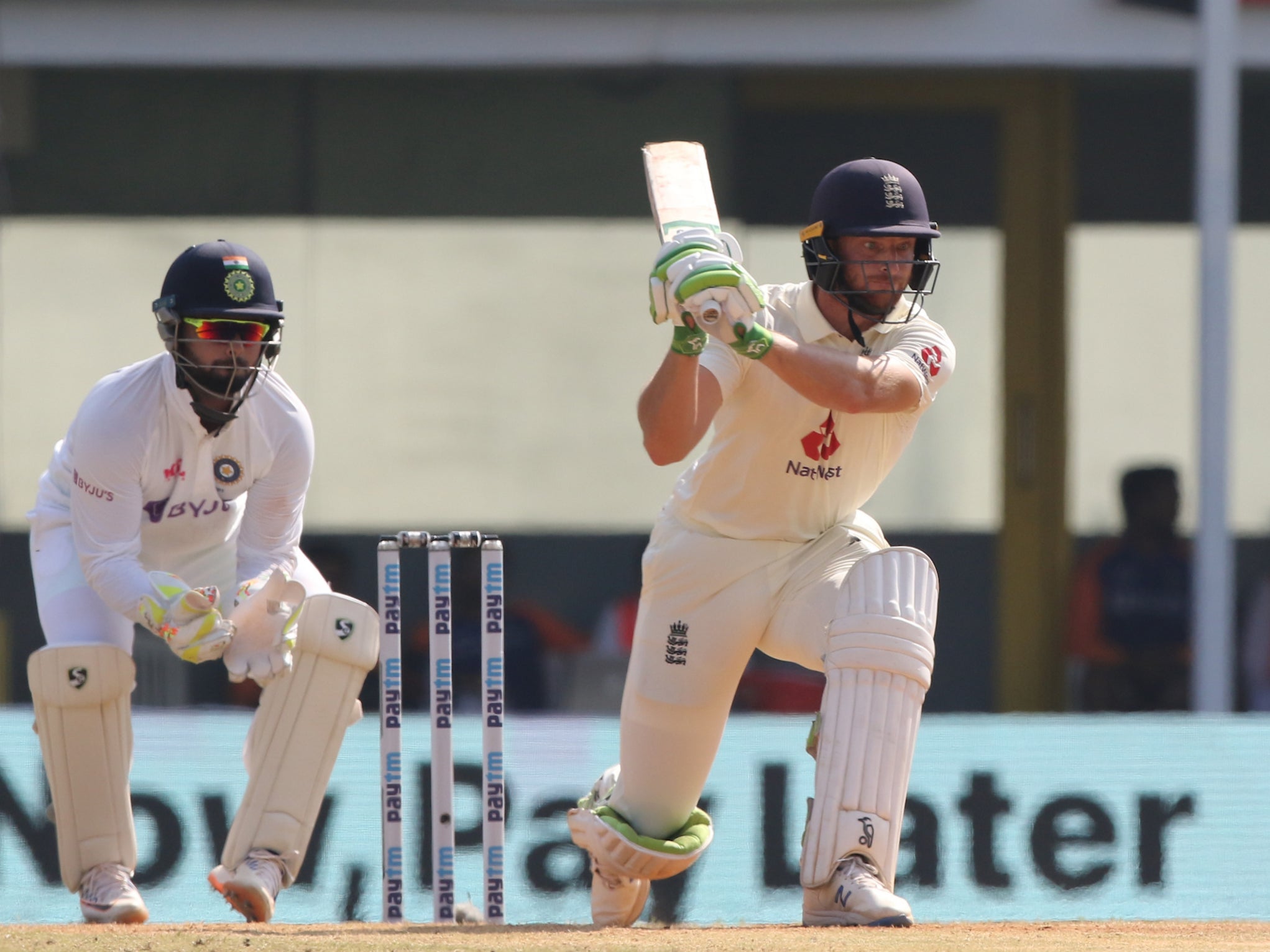 England’s Jos Buttler (right) in action on day four of the first Test in India