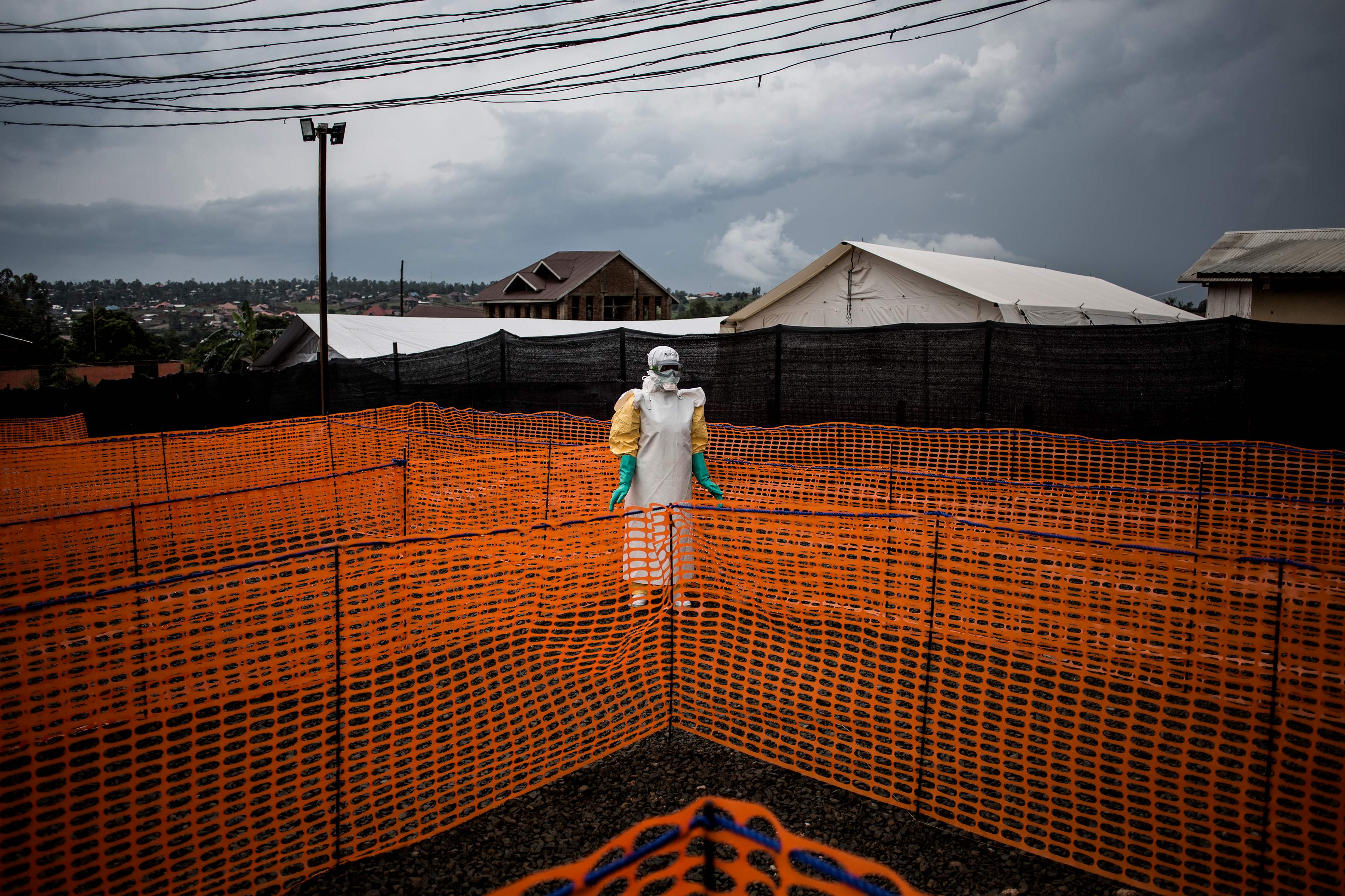 A health worker waits to handle a new unconfirmed Ebola patient at an Ebola treatment centre on in November 2018 in Bunia, Democratic Republic of the Congo