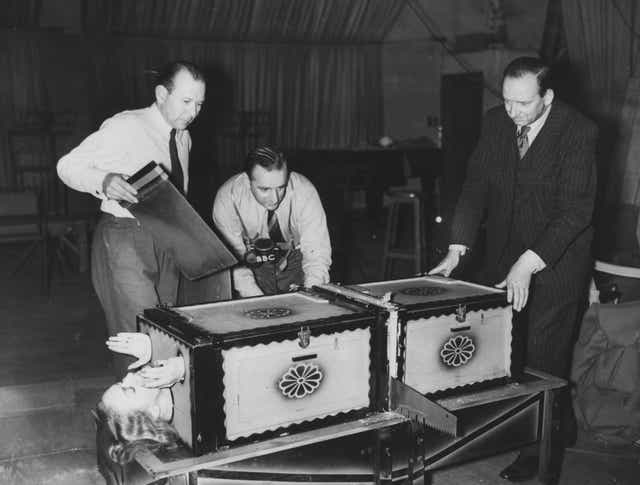 <p>Grate news: Brian Johnston broadcasts on the BBC’s Home Service in 1949 while sawing</p>