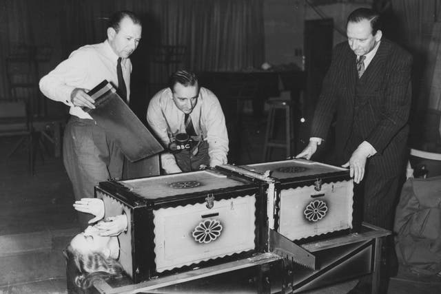 <p>Grate news: Brian Johnston broadcasts on the BBC’s Home Service in 1949 while sawing</p>