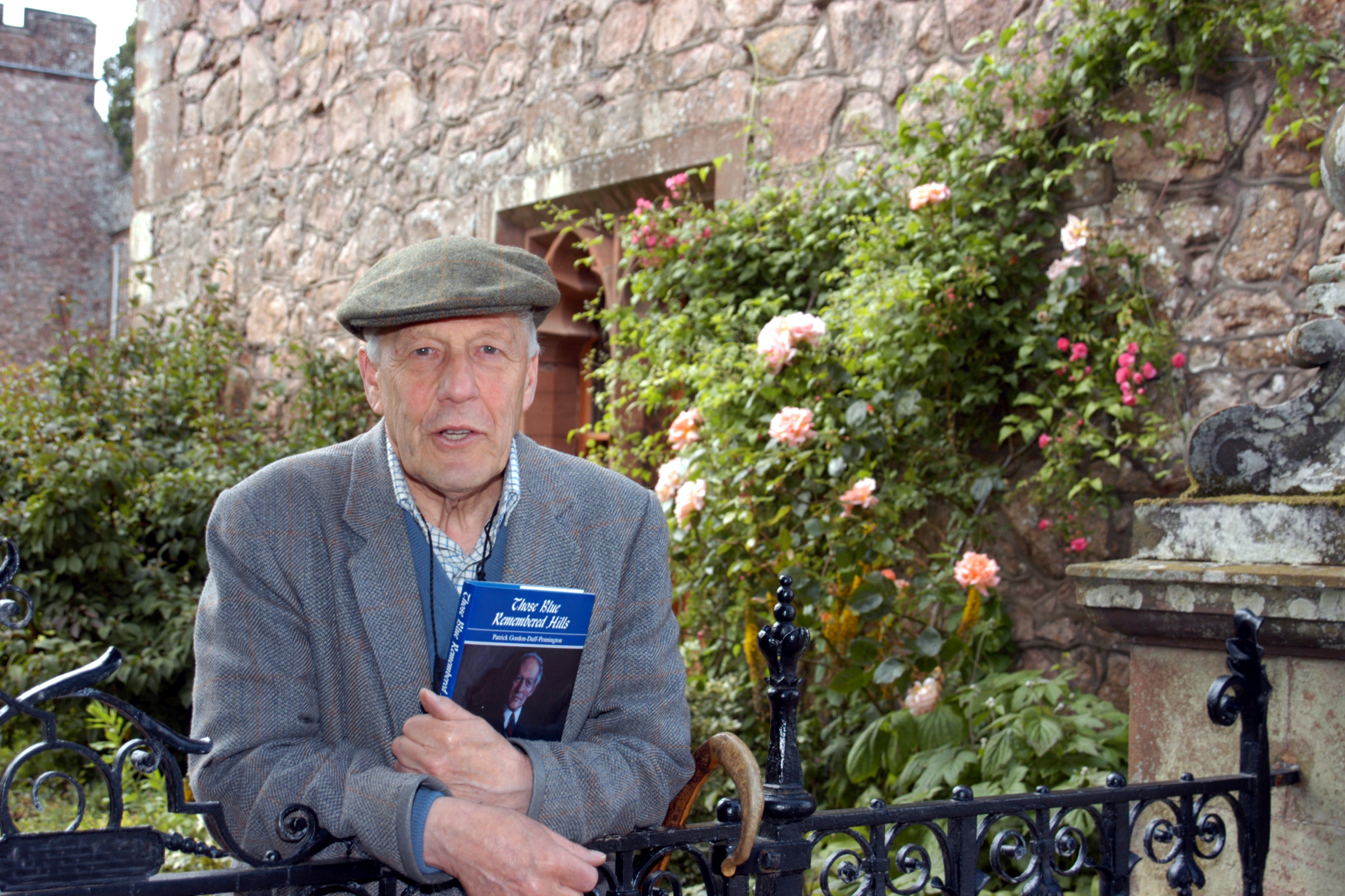 With a copy of his autobiography, ‘Those Blue Remembered Hills’