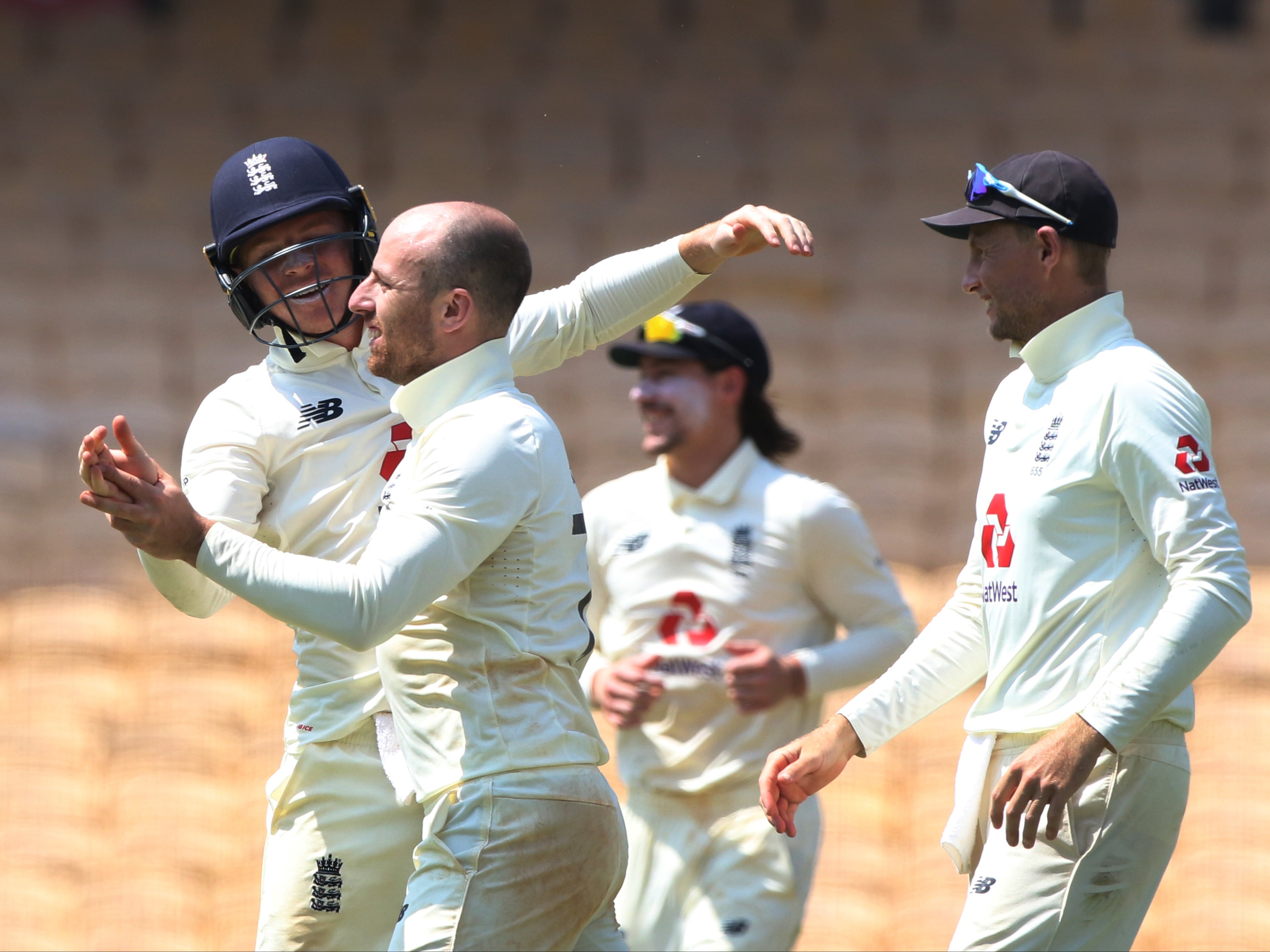 England players celebrate after Jack Leach takes a wicket