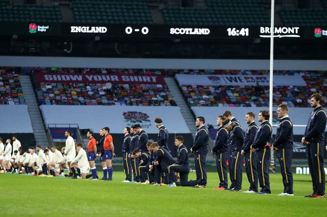 The teams line up for the Rugby Against Racism campaign during the Guinness Six Nations match between England and Scotland at Twickenham