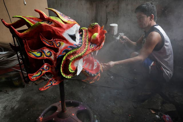 Virus Outbreak Philippines Dragon Dancers Photo Gallery