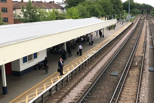 Emergency services were called to Surbiton station, southwest London, after a railway worker was hit by a train