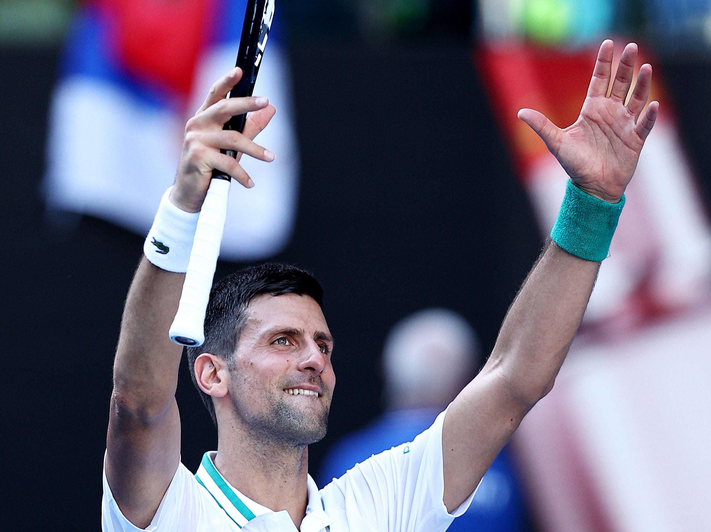 Novak Djokovic celebrates defeating Francis Tiafoe