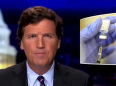 Tucker Carlson says US authorities ‘lying’ about Covid vaccines as conservative media sows doubts over safety