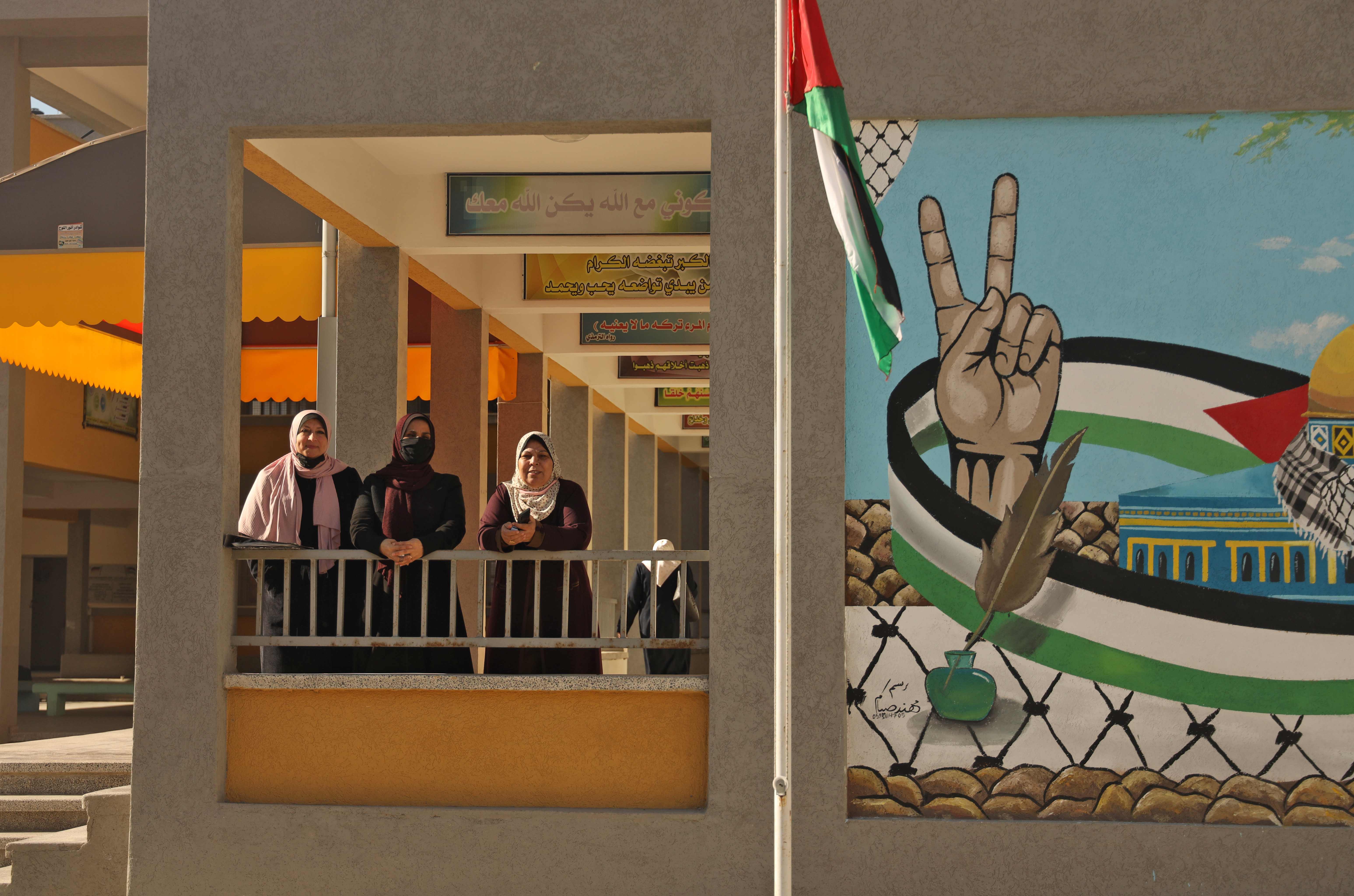Palestinian teachers are pictured near the opening of the first Voter Information and Registration Centre in Gaza City