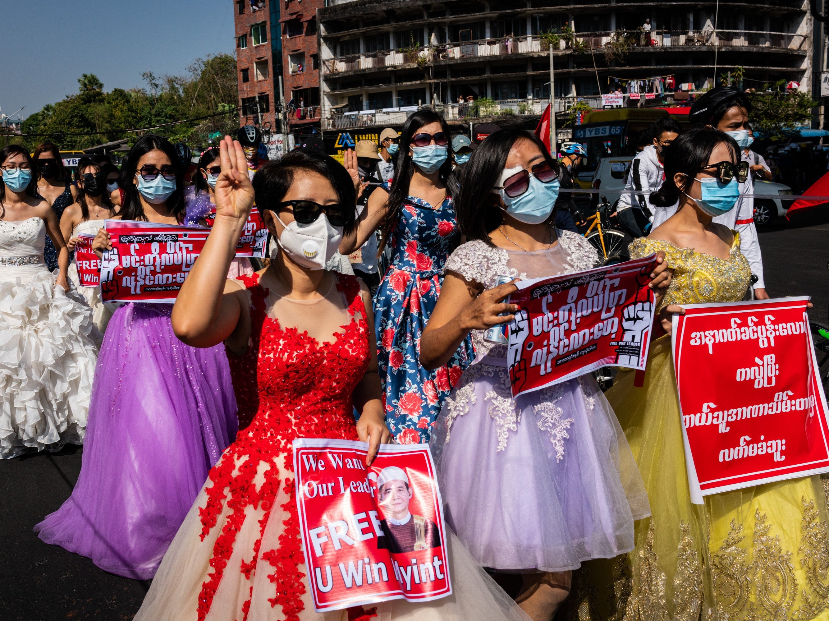 Protesters dressed in bridal costumes during a march against the military coup in Myanmar