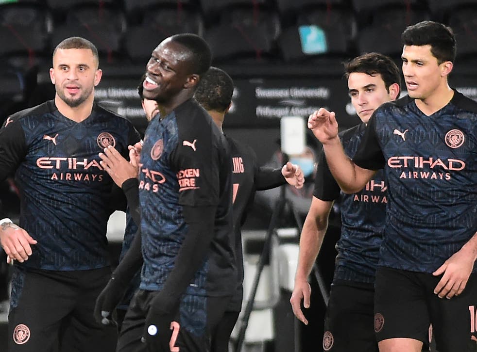 Manchester City players celebrate at Swansea