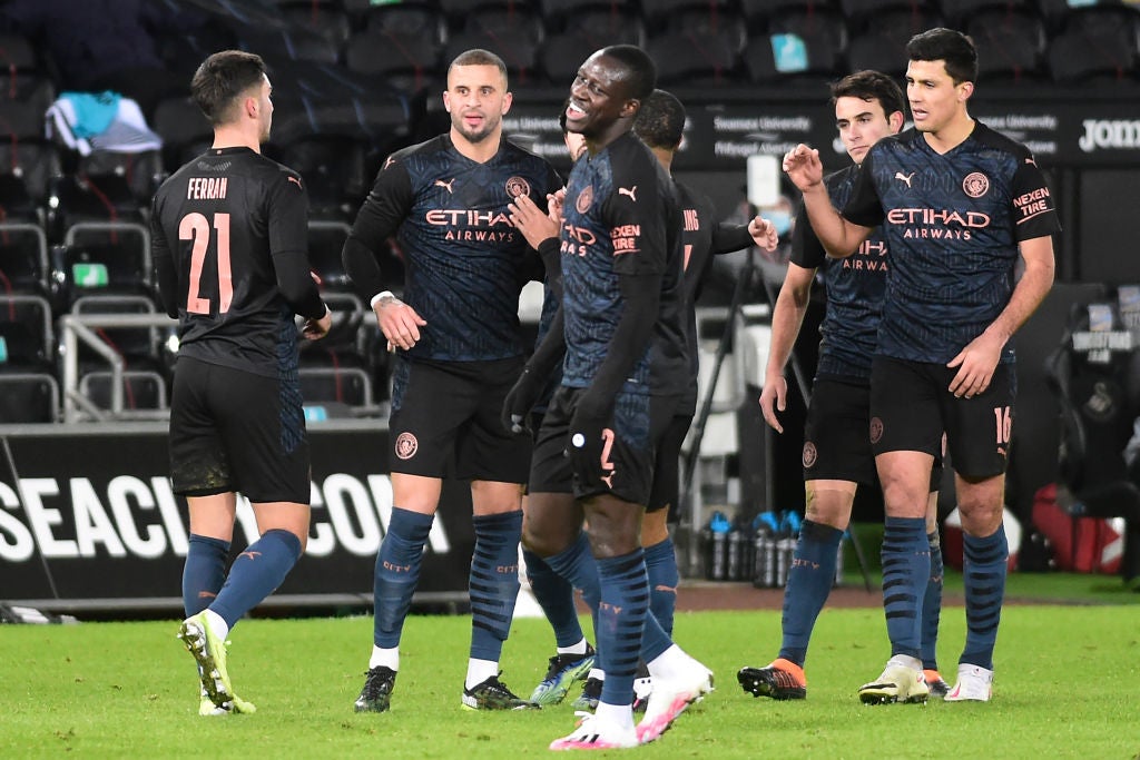 Man City players celebrate at Swansea