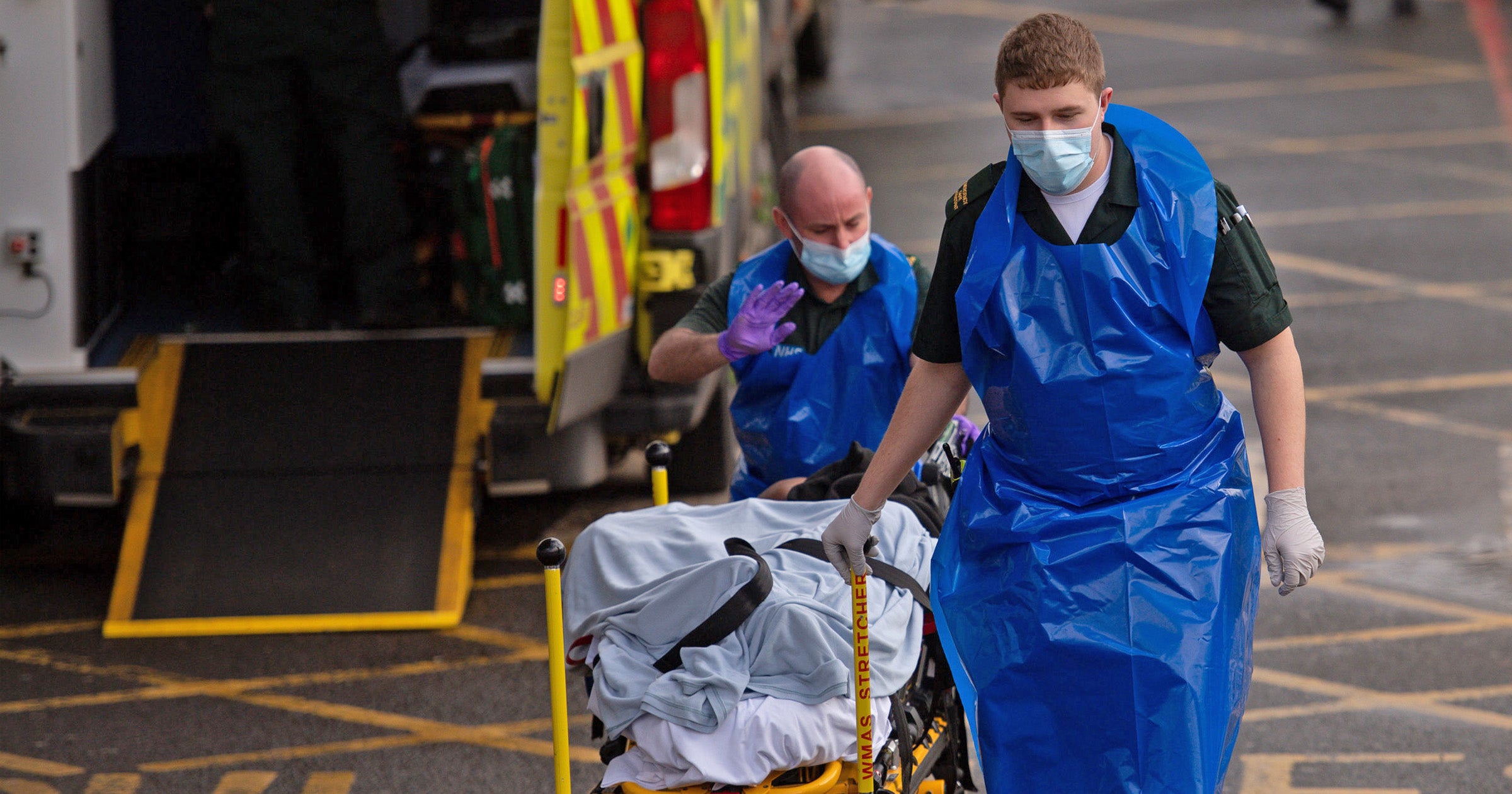 Ambulance crews transport patients into City Hospital in Birmingham