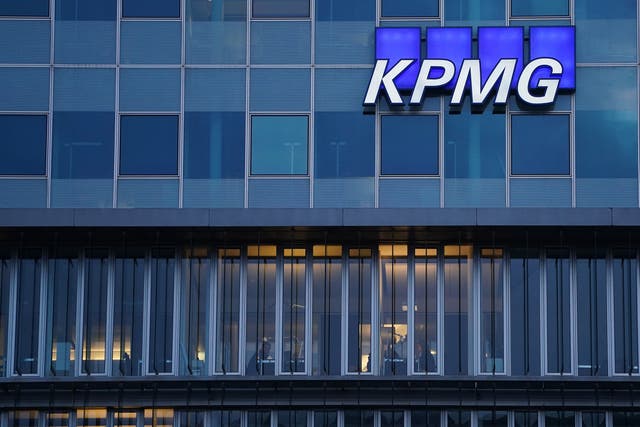 The logo of KPMG, a multinational tax advisory and accounting services company, hangs on the facade of a KPMG offices building on January 22, 2021 in Berlin, Germany