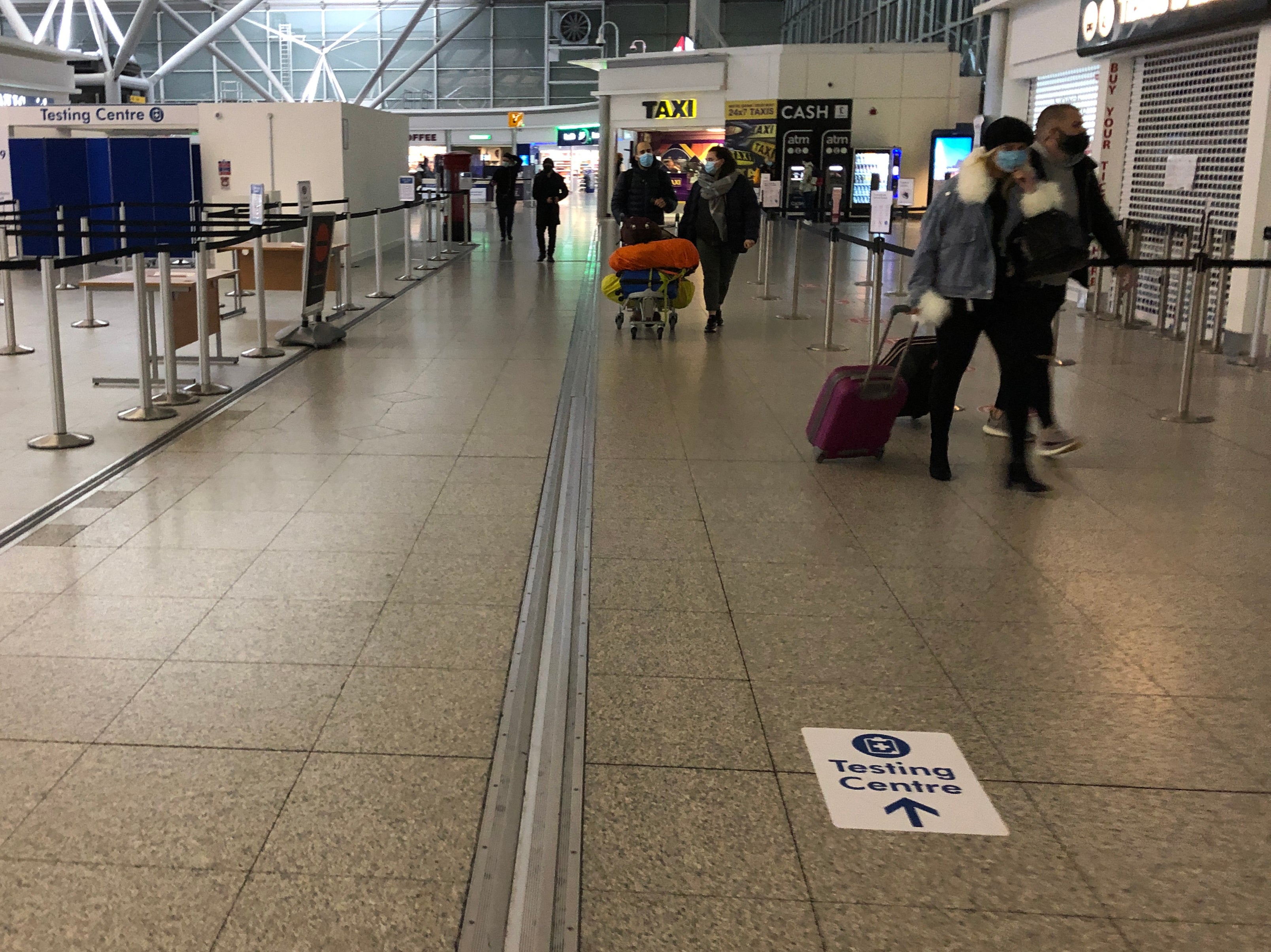 Check in: arriving travellers at Stansted airport