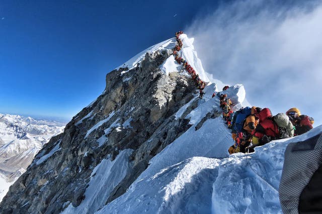 <p>This handout photo taken on May 22, 2019 and released by @nimsdai Project Possible shows heavy traffic of mountain climbers lining up to stand at the summit of Mount Everest.</p>