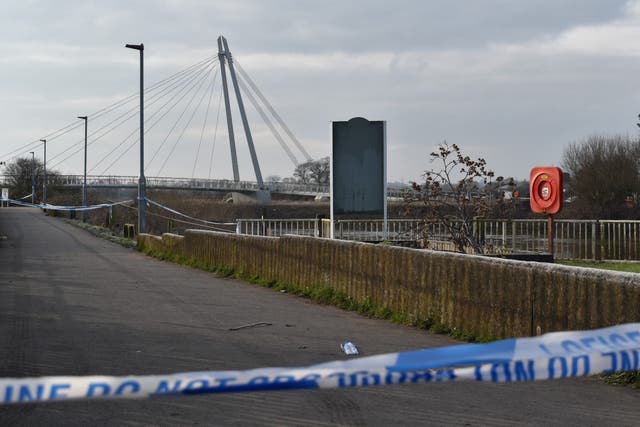 <p>A police cordon near the Diglis footbridge in Worcester, where specialist teams are searching a stretch of the River Severn after a man was arrested on suspicion of murder</p>