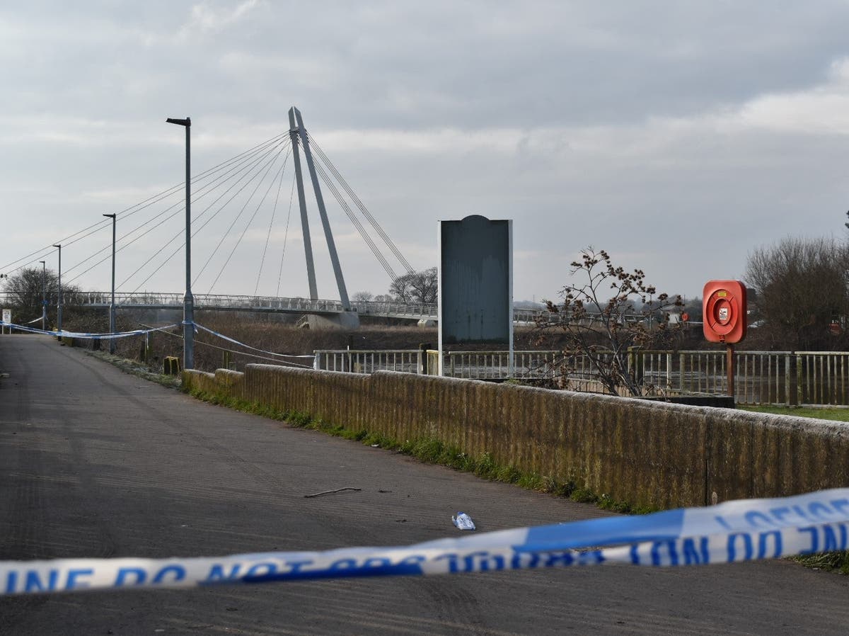 Police comb river after man arrested on suspicion of murder Police comb river after man arrested on suspicion of murder