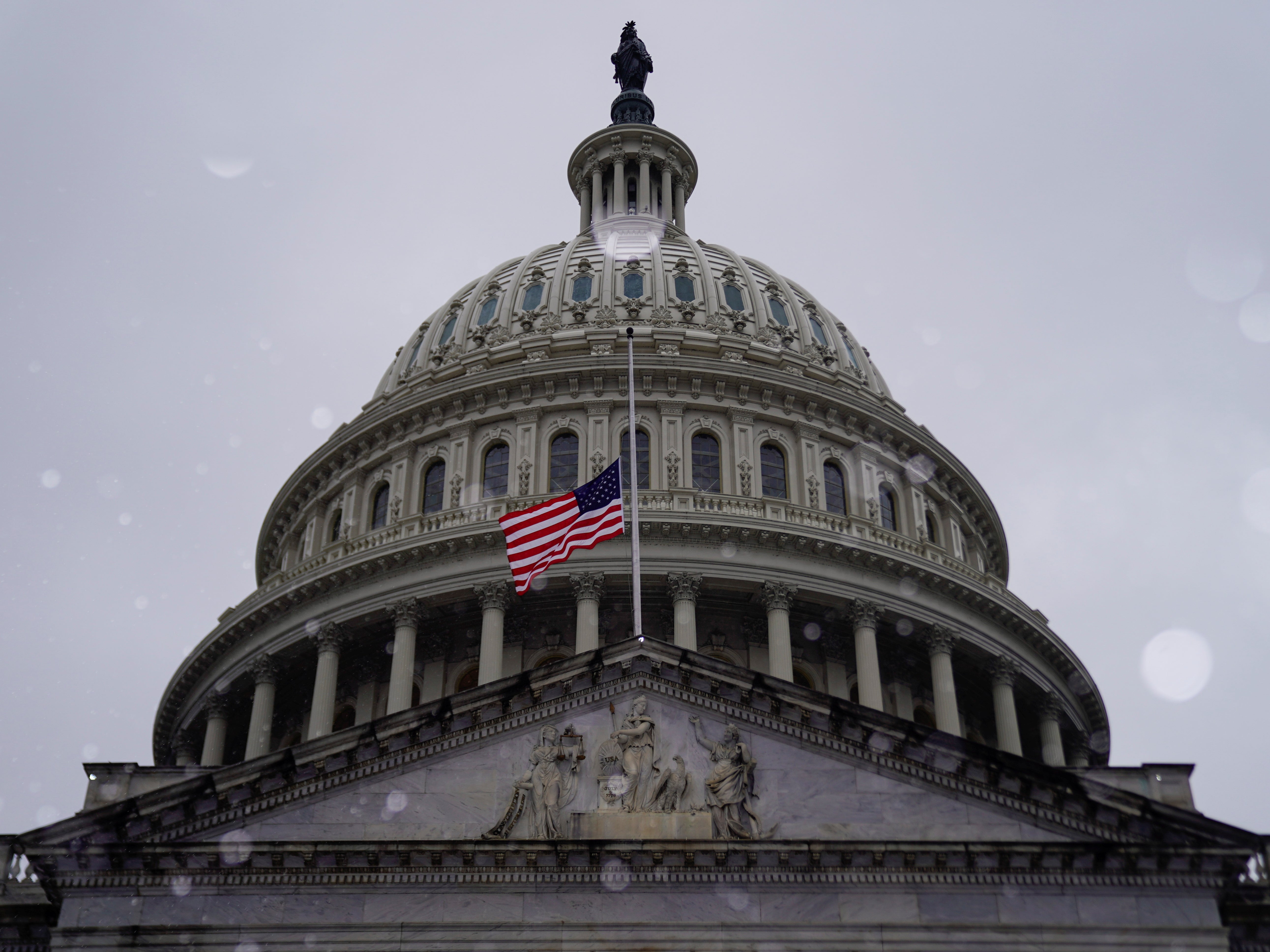 Snow falls at the US Capitol on the third day of senate impeachment hearings against former US president Donald Trump in Washington