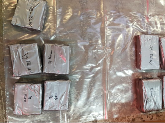 Two Hungarian nationals have been arrested after £12.5 million worth of heroin and cocaine was found in parcels heading to the UK