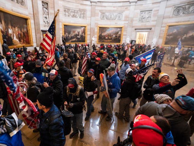 <p>Supporters of US President Donald J Trump in the Capitol Rotunda after breaching Capitol security in Washington, DC, on 6 January 2021</p>