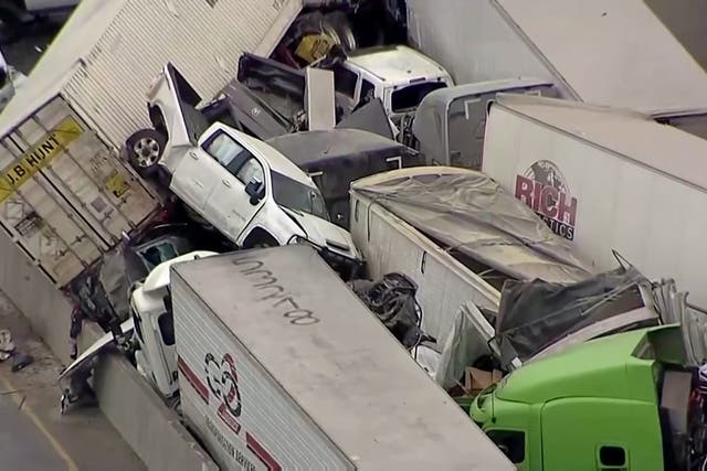 Cars and trucks are wedged together after a deadly multi-vehicle pileup on the ice covered I-35 in a still image from video in Fort Worth, Texas, U.S. February 11, 2021. NBC5 via REUTERS.  NO RESALES. NO ARCHIVES. MANDATORY CREDIT