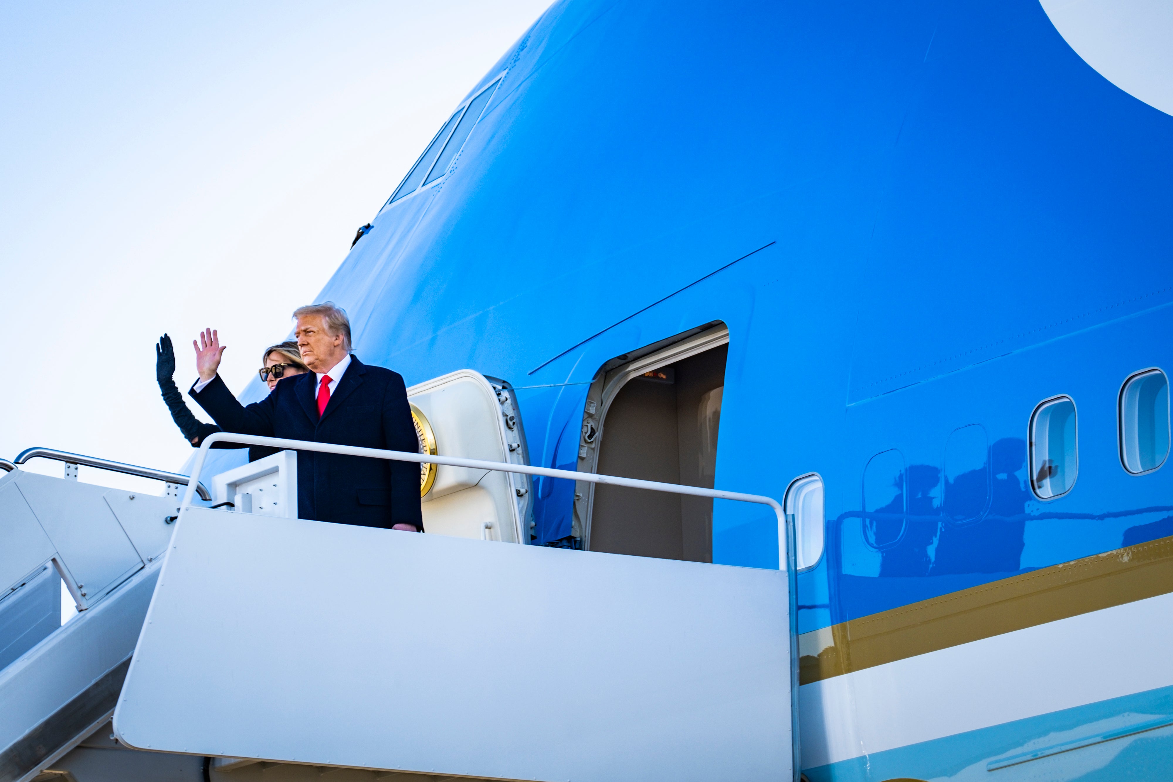 File Image: Former President Donald Trump and former First Lady Melania Trump board Air Force One at Joint Base Andrews before boarding Air Force One for his last time as President on 20 January 2021 in Joint Base Andrews, Maryland.