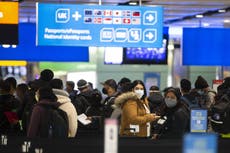 Travellers returning before launch of quarantine hotels queue for up to four hours at Heathrow Airport